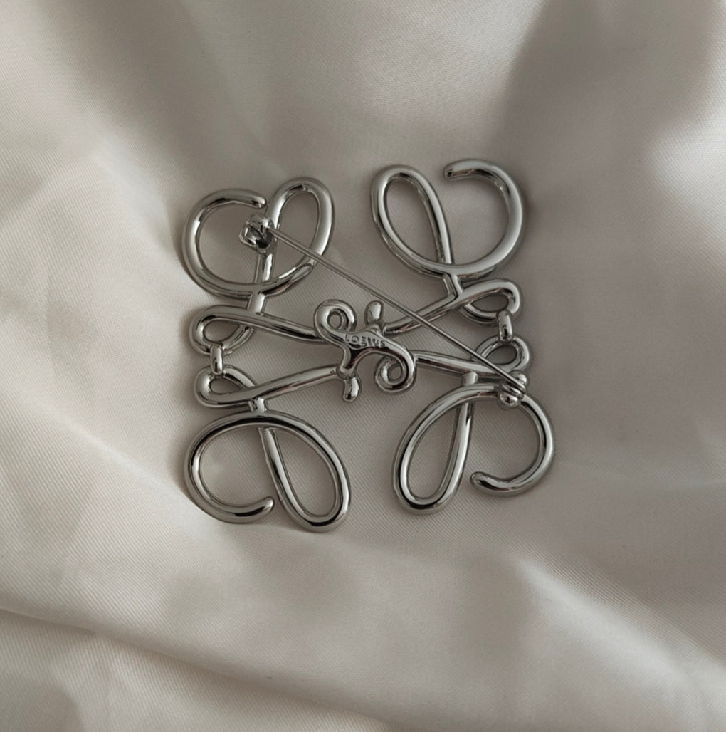 Anagram broche silver